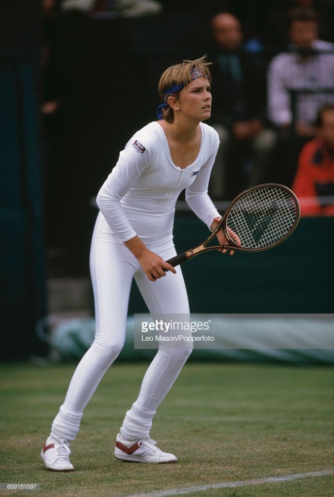 American tennis player Anne White pictured wearing a white body suit during action against Pam Shriv